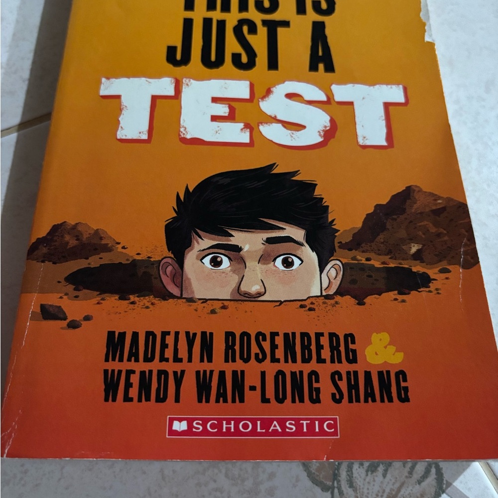 Scholastic Bright Orange Cover with Illustrated Boy Peeking